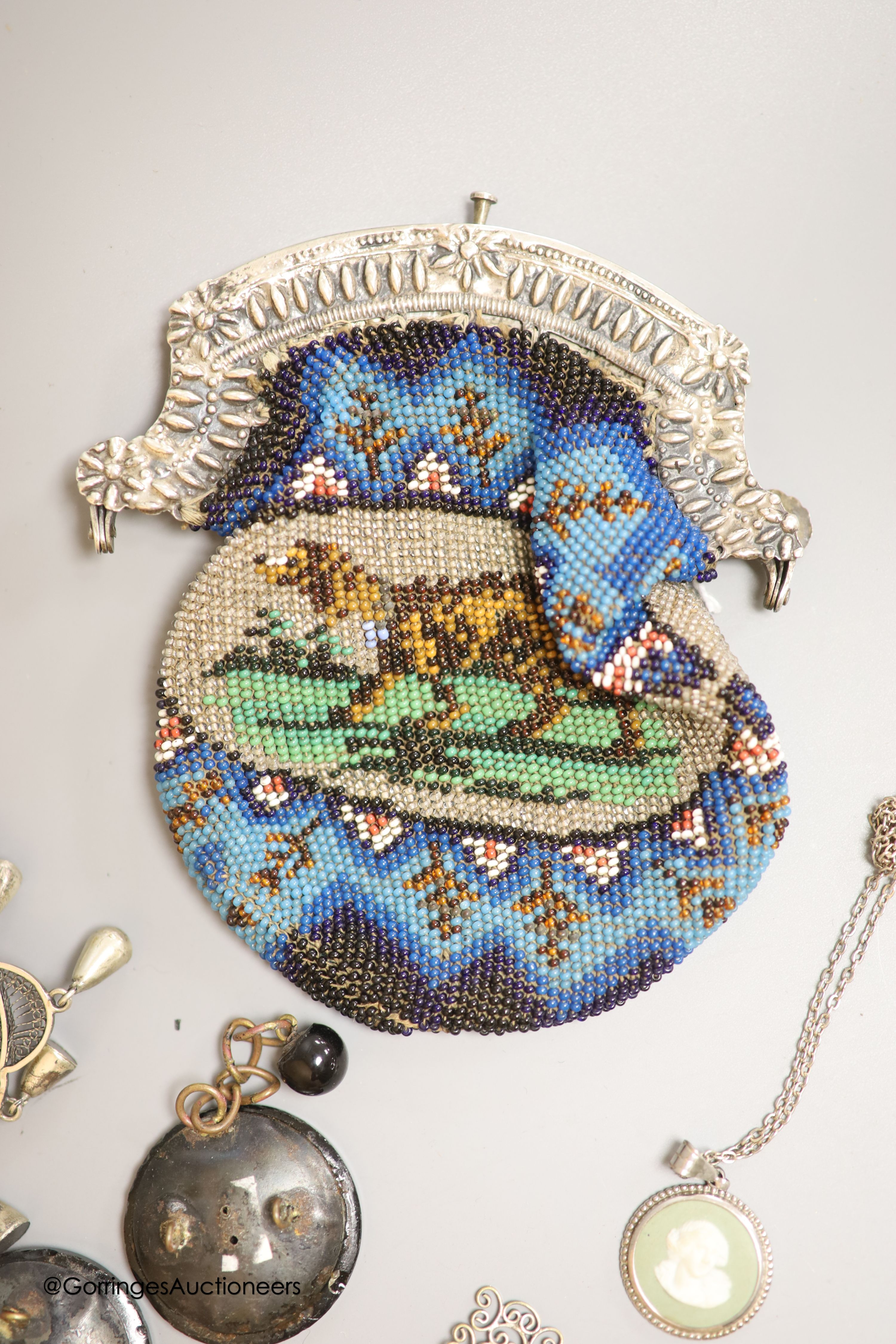A white metal mounted beadwork purse and other minor jewellery, including Royal Navy sweethearts brooch.